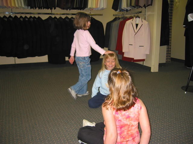Carrie, playing duck duck goose, with the two girls at the tux shop.