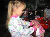 Carrie opening up another present.