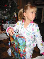 Carrie opens another present.