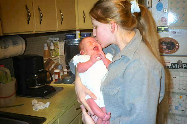 Mommy kissing a screaming Carrie.