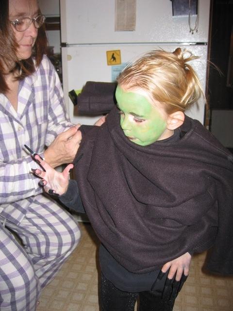 Grandmom helps Carrie get dressed.