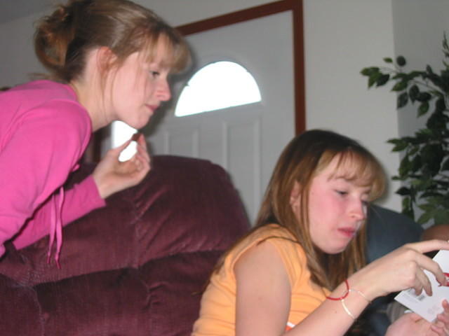 Brittany and Alicia read one of the cards. 10/5/03