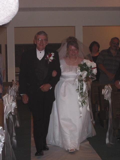 Richard escorting Michelle down the aisle. 10/4/03