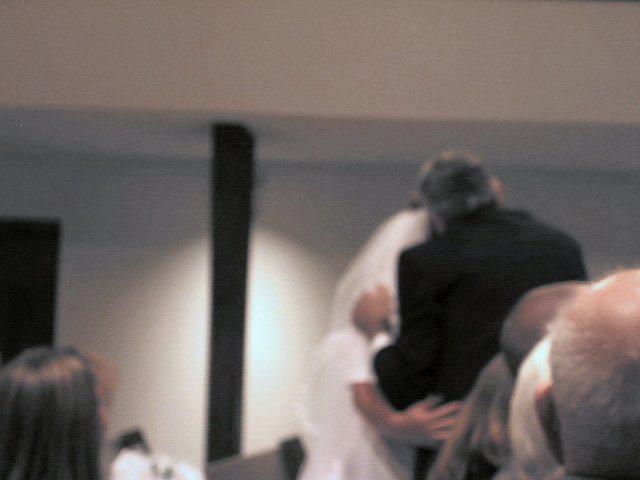 Okay, so you can't see.  Richard, Michelle's dad, was lifting her veil and kissing her cheek. 10/4/03