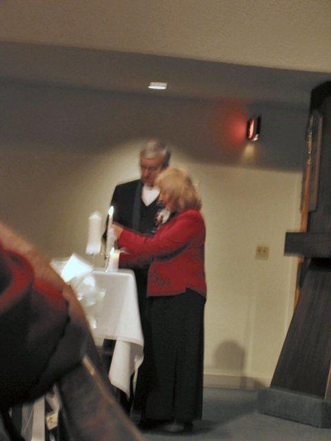 Michelle's parents, Richard and Rozanne light a second candle. 10/4/03