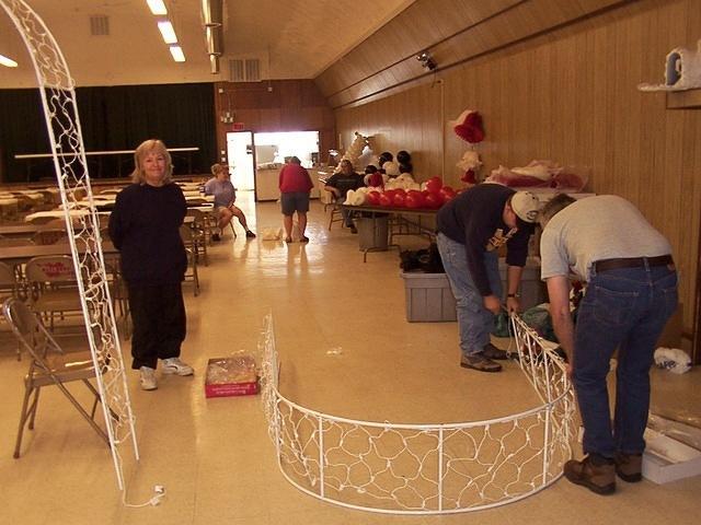Setting up decorations.  The woman looking at the camera is Michelle's mother, Rozanne.  10/3/03