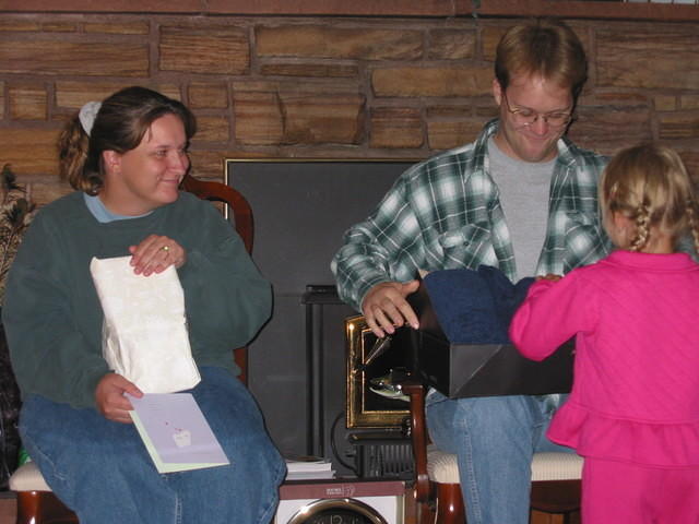 Carrie thinks she should help open presents... 9/12/03