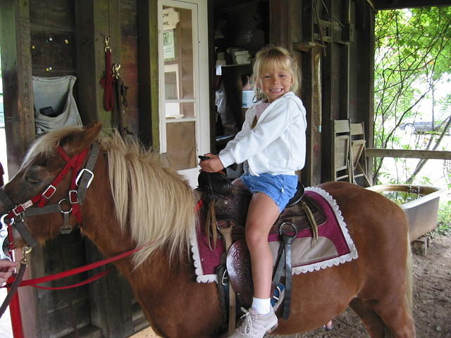 Carrie riding the pony