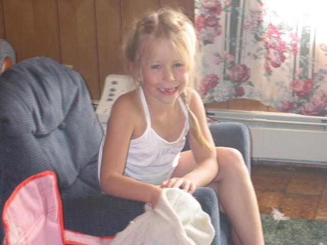 Carrie smiling at me in the living room.