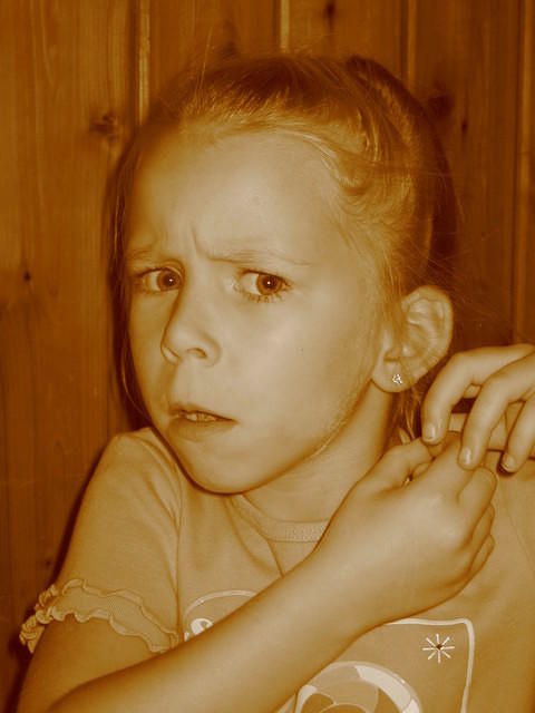 Carrie, trying to change her earrings.