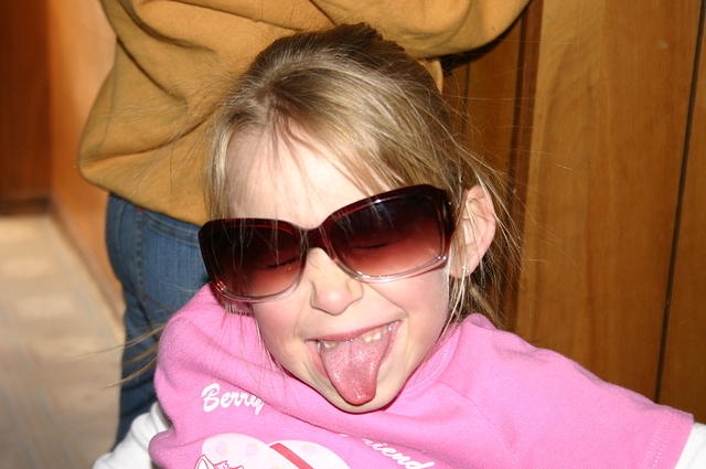 Carrie wearing Kelly's sunglasses.