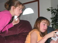 Brittany and Alicia read one of the cards. 10/5/03