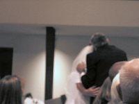 Okay, so you can't see.  Richard, Michelle's dad, was lifting her veil and kissing her cheek. 10/4/03