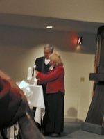 Michelle's parents, Richard and Rozanne light a second candle. 10/4/03