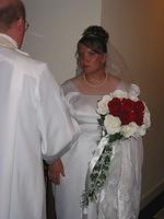 Turns out, Michelle is busy talking to the Rev. about the fact that they errored while filling out the marriage certificate, and