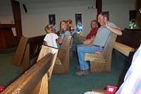 Carrie, and Paige, sitting next to Mom and Dad.  Behind us is Groomsman Blair, and Best Man, my brother Ric. 10/3/03