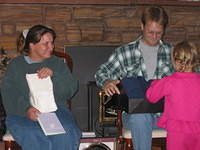 Carrie thinks she should help open presents... 9/12/03