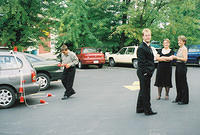 Kevin, Shawn, Michelle, and Aunt Suzy decorating the car.