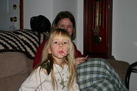 Michelle and Carrie eat candy canes.
