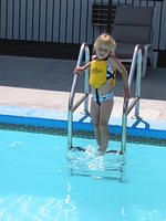 Carrie going down the ladder in the deep end.