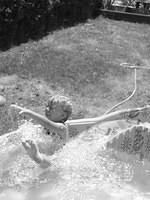 Carrie tried to slide down on her feet.  She fell.
