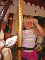 Carrie holding up the golden ring. (It means you get a free token)