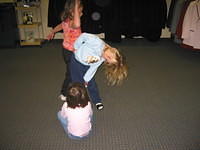 Carrie playing with two girls at the tux shop.