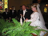 Eric and Aunt Dawn lighting the unity candle.