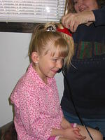 Carrie getting her hair done.