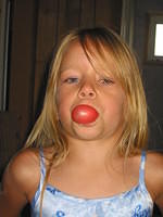 Carrie blowing a bubble