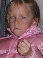 Carrie making a fist for Pap to scare him. ;D