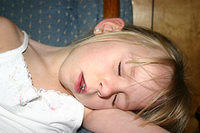 Carrie pretending to sleep