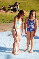 Carrie met a little girl at the spray park.