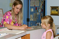 Carrie giving her donation to the Humane Society