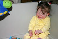 Lily stealing another toy of Joleigh's and Joleigh's protest.