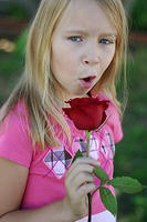 Carrie singing into her rose.