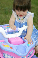 Joleigh inspecting her 4wheeler.